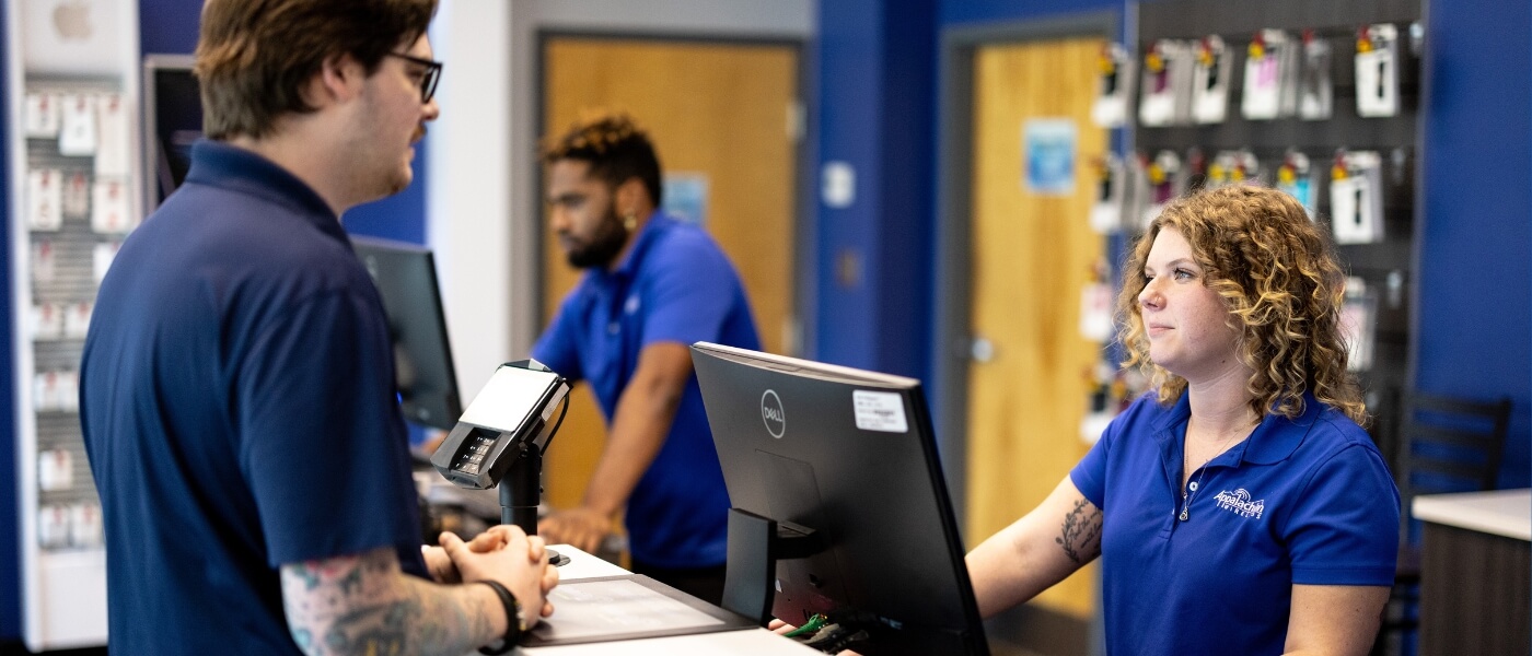 Appalachian Wireless employee serving a customer